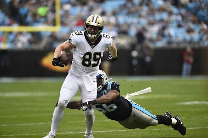 Dec 29, 2019; Charlotte, North Carolina, USA; Saints tight end Josh Hill (89) with the ball as Panthers linebacker Jermaine Carter (56). Mandatory Credit: Bob Donnan-USA TODAY
